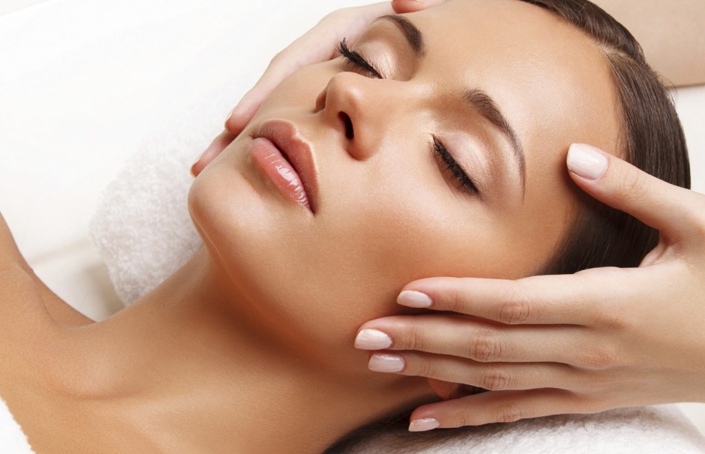 Face Massage. Close-up of a Young Woman Getting Spa Treatment.